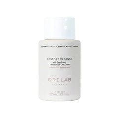 Travel shampoo bottle labeled RESTORE CLEANSE, 100ml, ORI LAB.