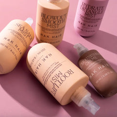 NAK hair luxe finishing creme bottles and sprays, pump-style containers