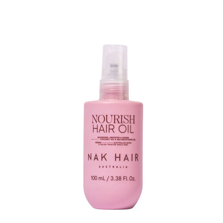 NAK Nourish Hair Oil 100 ml bottle with pink liquid and clear pump