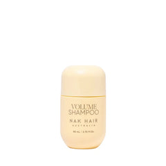 NAK Hair Volume Shampoo travel-size bottle, 80 ml, beige cap and label