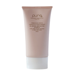 Leave-in hair treatment tube, pale pink with white cap