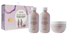 Organic skincare gift set with three bottles and a cream jar, white and beige labels