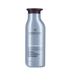 Hair care bottle with metallic blue label, dark cap, and printed ingredients on back