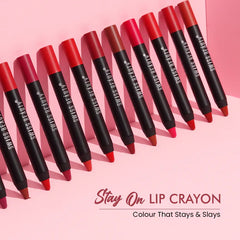 Set of orange-red matte lip crayons with black ends and pointed tips