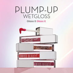 Plump-up WetGloss lip gloss display with stacked tubes and red gloss on wand