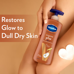 Vaseline cocoa glow serum-in-lotion bottle held with a white lotion heart