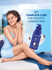 Body lotion bottle with model applying lotion, blue pump bottle