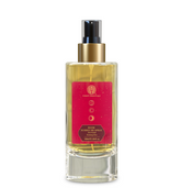 Rose room spray bottle with gold pump, clear glass, and red front label