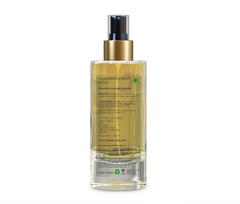 Rose room spray bottle back view with gold pump and detailed ingredient/usage label