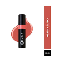 Brick-red glossy lipstick in tube with smear swatch