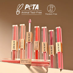 Set of dual-ended lipsticks standing upright in multiple pink and red shades.