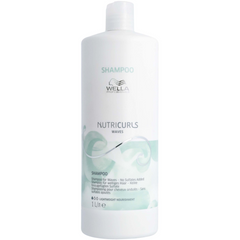 White Wella Professionals Nutricurls shampoo bottle, 1L with SHAMPOO label