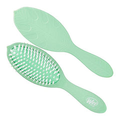 Mint green hair brush with white bristles, paddle shape, long handle