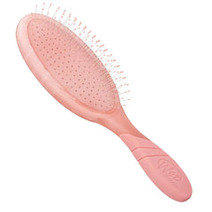 Peach oval hair detangler brush with fine bristle tips and cushioned pad