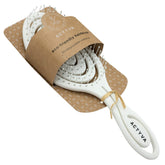Actyva eco-friendly hairbrush with white oval cushion and pin bristles, angled view