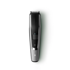 Beard trimmer with textured grip and power button, front view
