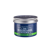 Aftershave balm jar with Bluebeards Revenge label, blue-green band, and silver lid