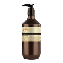 Brown shampoo bottle with black pump, beige label and gold accents