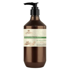 Hair care shampoo bottle with brown liquid, black pump, and cream label