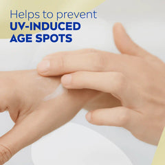 Anti-age hand cream applied on hands, smooth cream layer