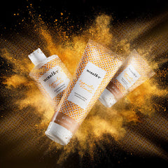 Brightening mask set with gold lattice bottles and splashing amber powder