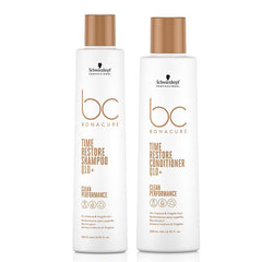 Schwarzkopf BC Bonacure Time Restore shampoo and conditioner bottles, white with gold caps
