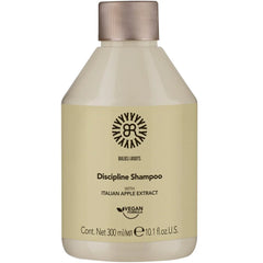 Cream shampoo bottle with beige cap, Discipline Shampoo label, 300 ml