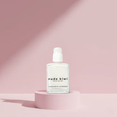 Hand serum bottle on pedestal, white pump and clear glass