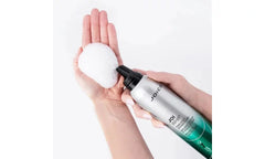 Hair foam applicator: Joico Joi Whip bottle dispensing white foam onto hand