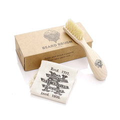Beard brush with light wood handle and pale bristles