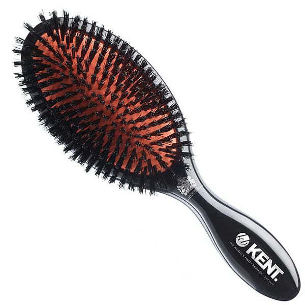 Large oval hairbrush with black bristles and curved black handle, Kent logo on handle