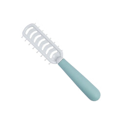 Vented hairbrush with white bristle pad and curved light blue handle, angled view.