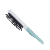 Small vented paddle hairbrush with black bristles and light blue handle.