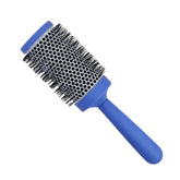 Ceramic round hairbrush with blue handle and black bristles, angled view