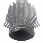 Hair styling gel brush head with long pins on dark rounded base