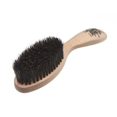 Wooden hairbrush with dense dark bristles on a curved oval base