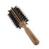 Large round vented hair brush with mixed black bristles and light wood handle