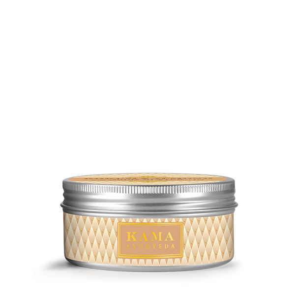 Kama Ayurveda body butter jar with ribbed silver lid and gold diamond pattern label
