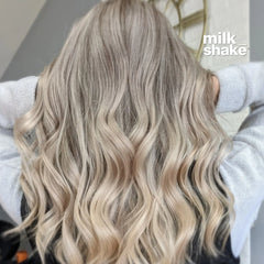Blonde wavy hair with Milk_shake logo