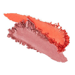 Two-tone blush swatch in coral-orange and dusty rose across skin-like smear