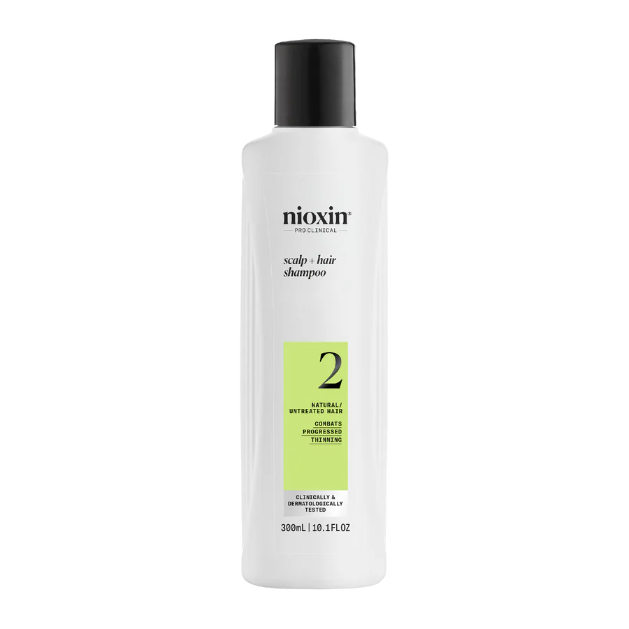 Nioxin scalp + hair shampoo bottle, white with black cap and green number 2 label