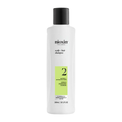 Nioxin scalp + hair shampoo bottle, white with black cap and green number 2 label