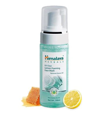 Himalaya Oil Clear Lemon foaming face wash bottle with pump and lemon beside it