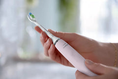 Sugar Rose electric toothbrush, front view with branded grip