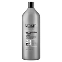 Redken hair cleansing cream clarifying shampoo bottle, silver-gray with black cap