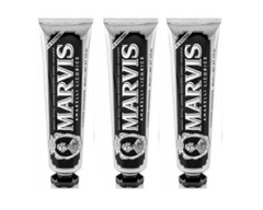 Marvis licorice mint toothpaste set with three tubes, black cap and white body.