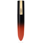 Lip gloss tube with black cap and gold label, warm brown-red shade.