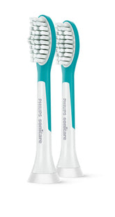 Toothbrush head pair with white bristles and teal neck, on white handles