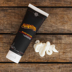 Suavecito beard butter tube with white cream dollops beside it