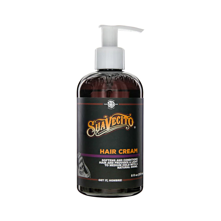 Suavecito hair cream bottle with pump, dark amber/black container and purple label.